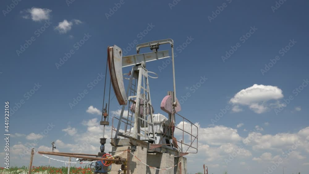 Onshore land drilling Oil well rig with blue sky in 4k 30 fps Onshore land drilling Oil well rig with blue sky in 4k 30 fps