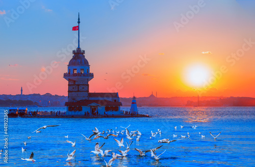 Istanbul Maiden Tower (kiz kulesi) with seagull flying at amazing sunset - Istanbul, Turkey 