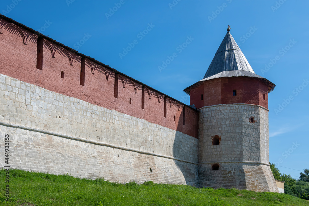 Wall and tower of medieval Zaraysk Kremlin at sunny day. Moscow Oblast, Russia.