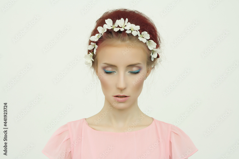 beautiful young woman in floral hat. spring colorful beauty girl with flowers