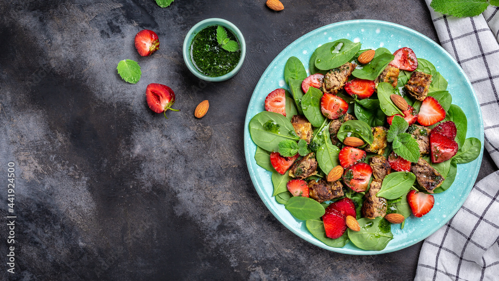 Strawberry Salad with baby spinach, chicken liver, almond and mint. Healthy fats, clean eating for weight loss