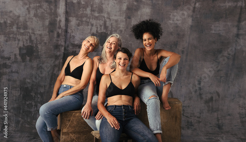 Cropped shot of diverse women laughing together