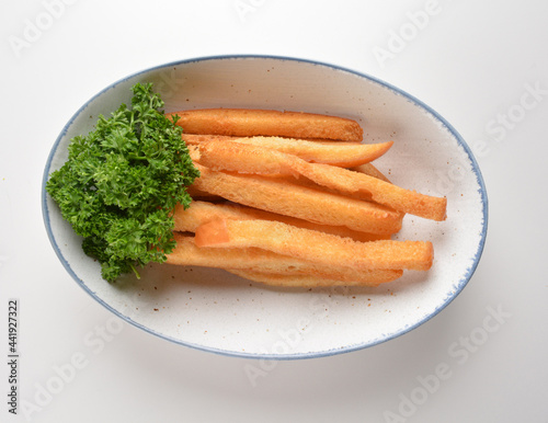 deep fried crispy long stick bread cookies pastry bakery French fries fast food snack in bowl on white table restaurant asian cafe halal chinese banquet menu