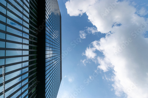 Companies buildings. Finance corporate architecture city in abstract blue sky with nature cloud in sunny day. Modern office business building with glass, steel facade exterior.
