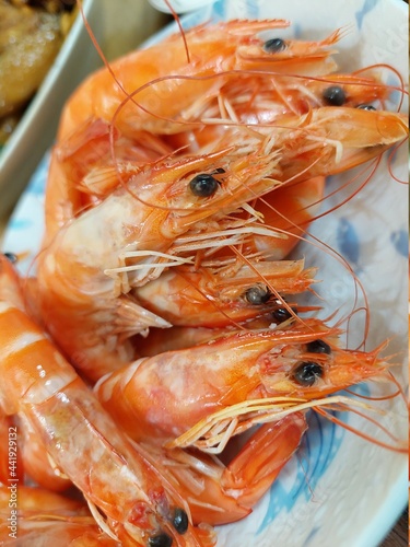 cooked shrimps in the dish design for delicious seafood background