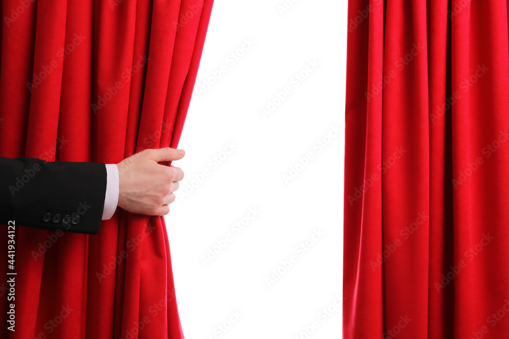 Man opening red front curtains on white background, closeup - obrazy, fototapety, plakaty 