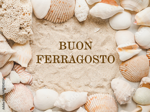 Happy August. Buon Ferragosto. Beautiful card for Italian holiday. Close-up, view from above. National holiday concept. Congratulations for family, relatives, friends and colleagues photo