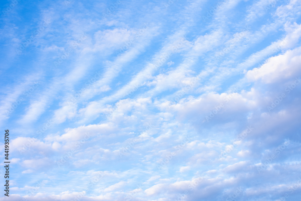 Fototapeta premium Blue sky with white fluffy clouds, copy space, abstract background