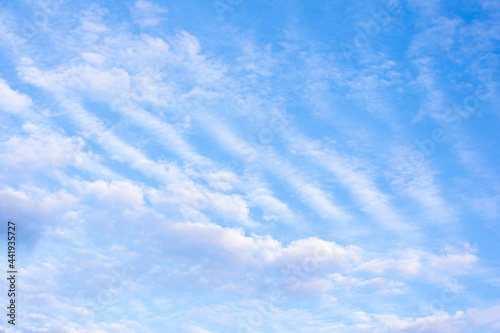 Blue sky with white fluffy clouds, copy space, abstract background