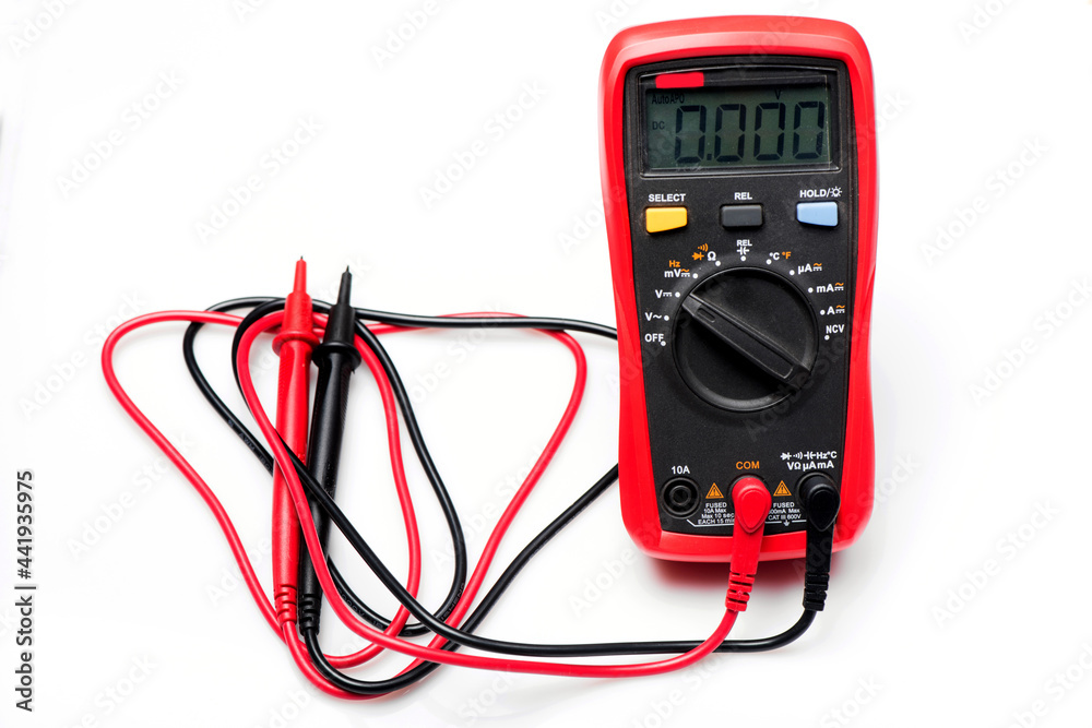 Electronic digital multimeter isolated on white with probes. Digital multimeter with red and black leads. Electronic multimeter isolated on white background close up Electronic digital multimeter isolated on white with probes. Digital multimeter with red and black leads. Electronic multimeter isolated on white background close up