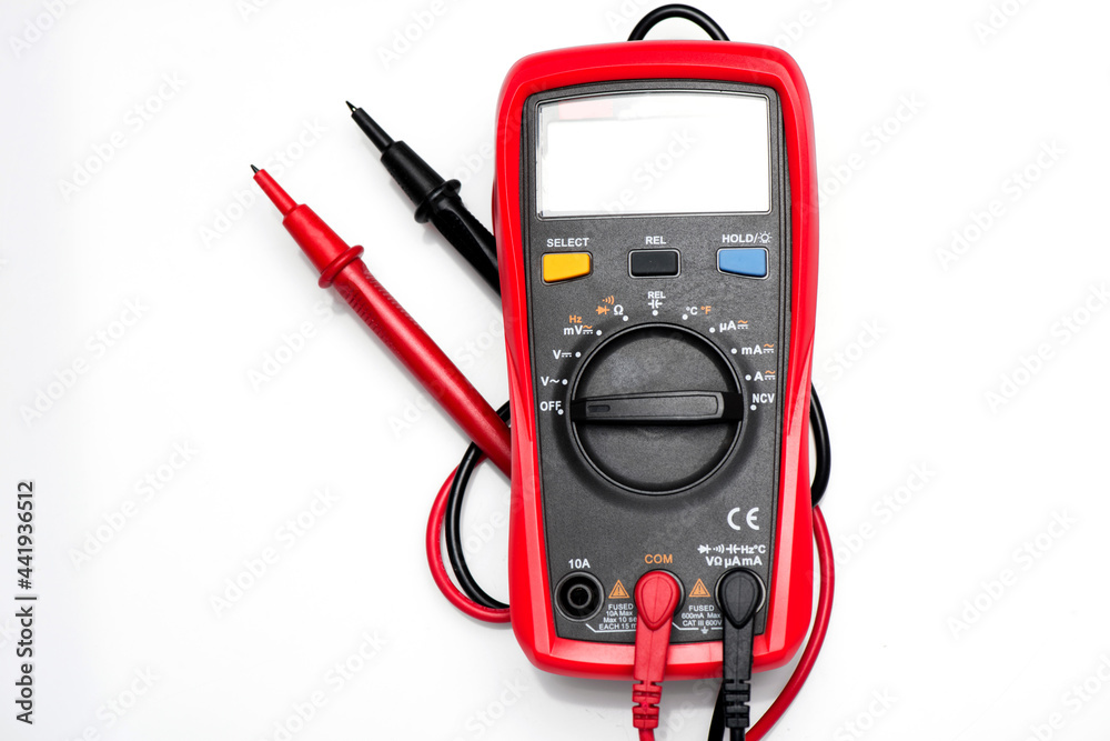 Electronic digital multimeter isolated on white with probes. Digital multimeter with red and black leads. Electronic multimeter isolated on white background close up Electronic digital multimeter isolated on white with probes. Digital multimeter with red and black leads. Electronic multimeter isolated on white background close up