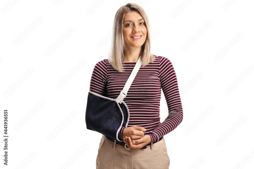 Young woman with a broken arm wearing an arm splint smiling at camera - obrazy, fototapety, plakaty 