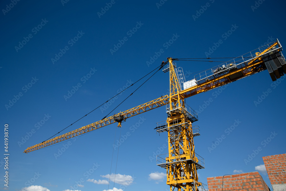 The process of building a house. metal structures. Construction concept. Tower cranes are building a new residential building.