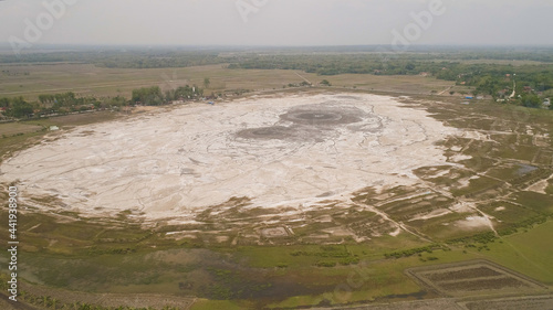 Mud volcano bledug kuwu. aerial view volcanic plateau with geothermal activity and geysers, Indonesia java. aerial view volcanic landscape photo