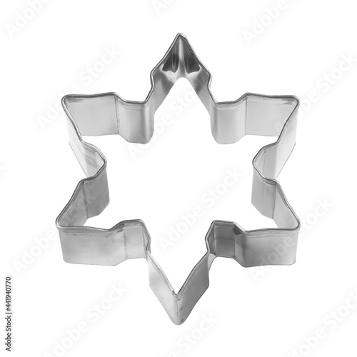 Baking dish for Christmas cookies in the shape of snowflake isolated on white