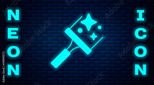 Glowing neon Cleaning service with of rubber cleaner for windows icon isolated on brick wall background. Squeegee, scraper, wiper. Vector