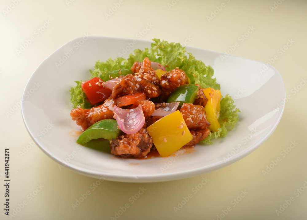 Fototapeta premium popular chef cook fried sweet and sour chicken with vegetables serve with steam white rice asian halal menu