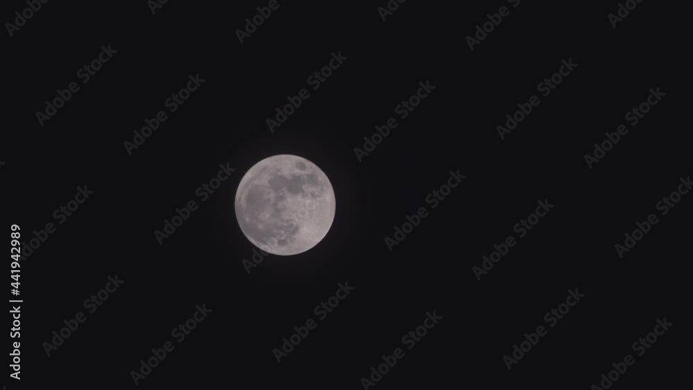 Full moon rising on night sky. Full moon rising on night sky.