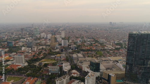 Aerial cityscape modern city Surabaya with skyscrapers  buildings and houses. sunset in city skyline with skyscrapers and business centers Surabaya capital city east java  indonesia