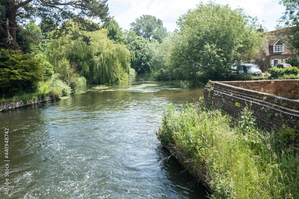 Romsey, Hampshire, UK – June 15 2021. The historic Sadler’s Mill on the River Test on the Romsey Heritage trail. Captured on a bright and sunny day Romsey, Hampshire, UK – June 15 2021. The historic Sadler’s Mill on the River Test on the Romsey Heritage trail. Captured on a bright and sunny day