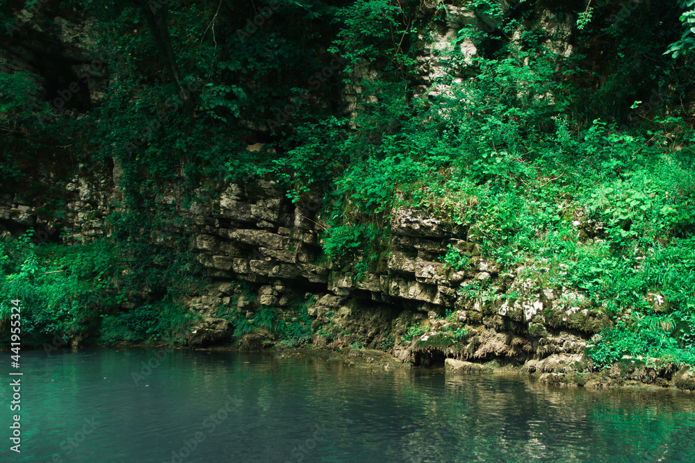 Martvili Canyon in Georgia. Turquoise water in a mountain river and cliffs of the reserve. Beautiful natural canyon Martvili Canyon in Georgia. Turquoise water in a mountain river and cliffs of the reserve. Beautiful natural canyon