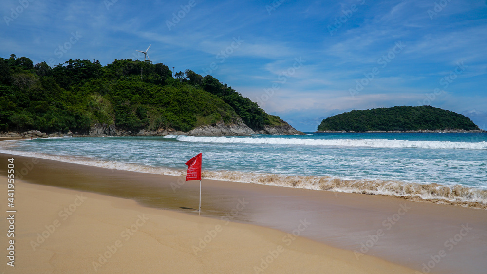 Red flag on the Nai Harb beach on Phuket islan