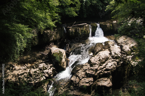 Martville Canyon. a mountain waterfall that flows into a mountain river. amazing georgia photo