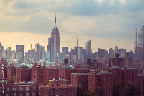 Nyc skyline in cloudy weather during setting sun