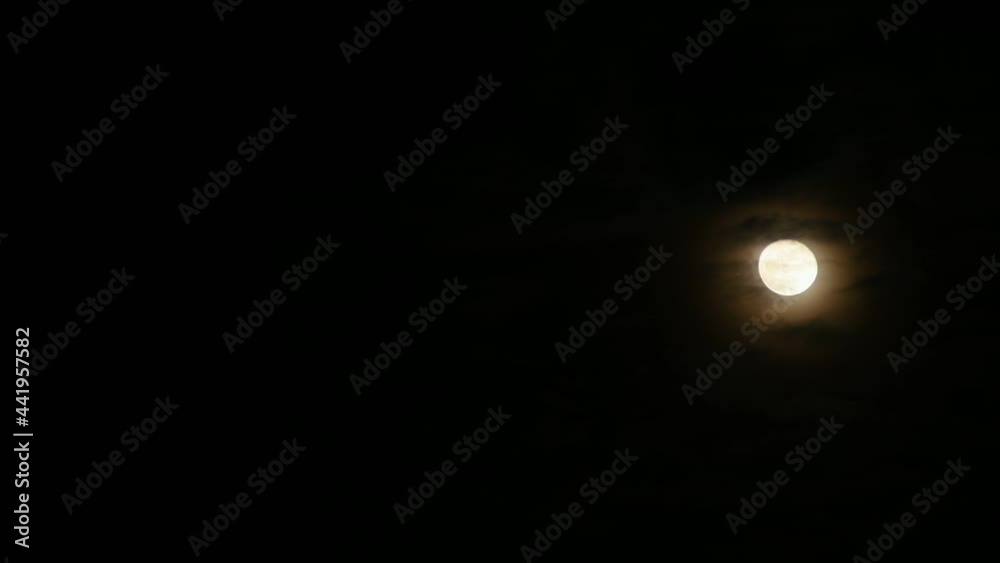 Clouds passing by moon at night. Full moon at night with cloud real time. mystery fairyland scene. Clouds passing by moon at night. Full moon at night with cloud real time. mystery fairyland scene.