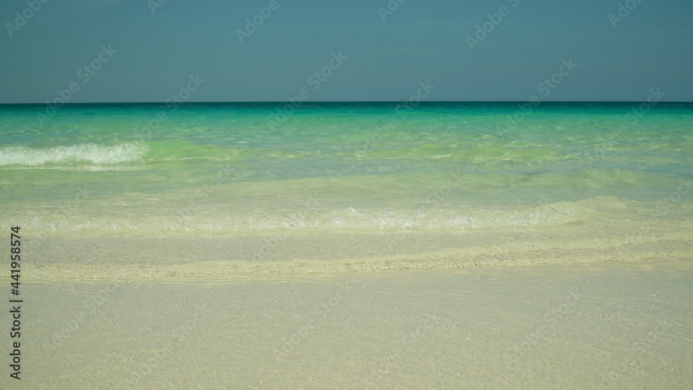 Seascape: blue sea and tropical beach on a background of blue sky. Summer and travel vacation concept. Boracay, Philippines