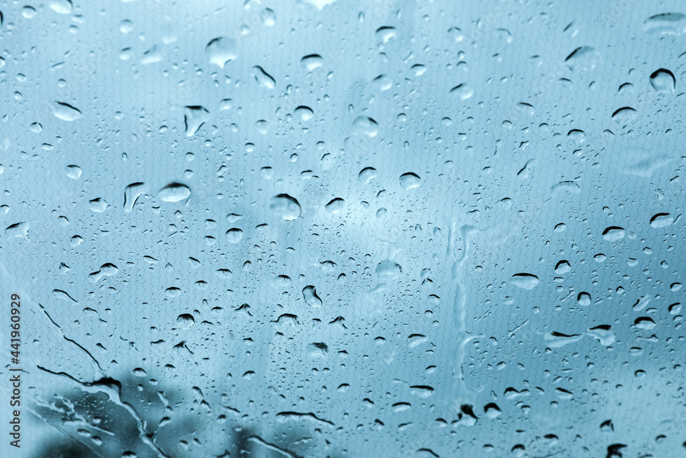 Window glass with water drops, closeup view Window glass with water drops, closeup view