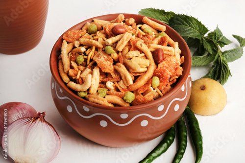 Indian Snacks, Bombay mix or namkeen, Chiwda or farsan is an Indian snack mix, popular tea-time food from India, delicious blend of sev, peanuts, peas and fried lentil. photo