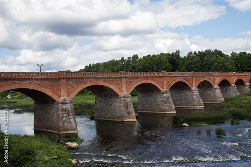 An ancient bridge built of stone and red bricks