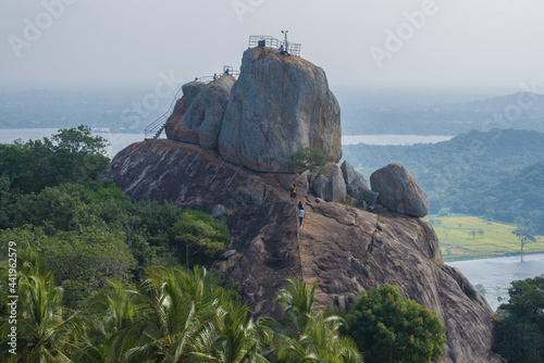View of the Invitation Rock (Aradhana Gala) on a foggy morning. Mango Plateau, Ambasthala. Mihintale, Sri Lanka