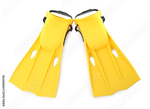 Pair of yellow flippers on white background, top view photo