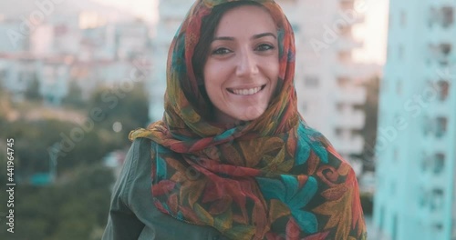 Portrait of young muslim woman with traditional head scarf, hijab. Culture, ramadan or islam concept.