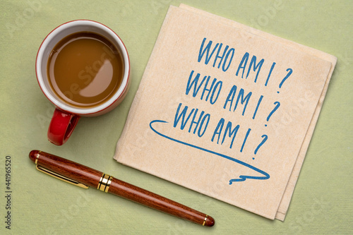 Who am I? A philosophical question  on a napkin with coffee. Personal development, life purpose, identity, lifestyle and career concept.