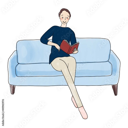 ソファーで読書をする男性
