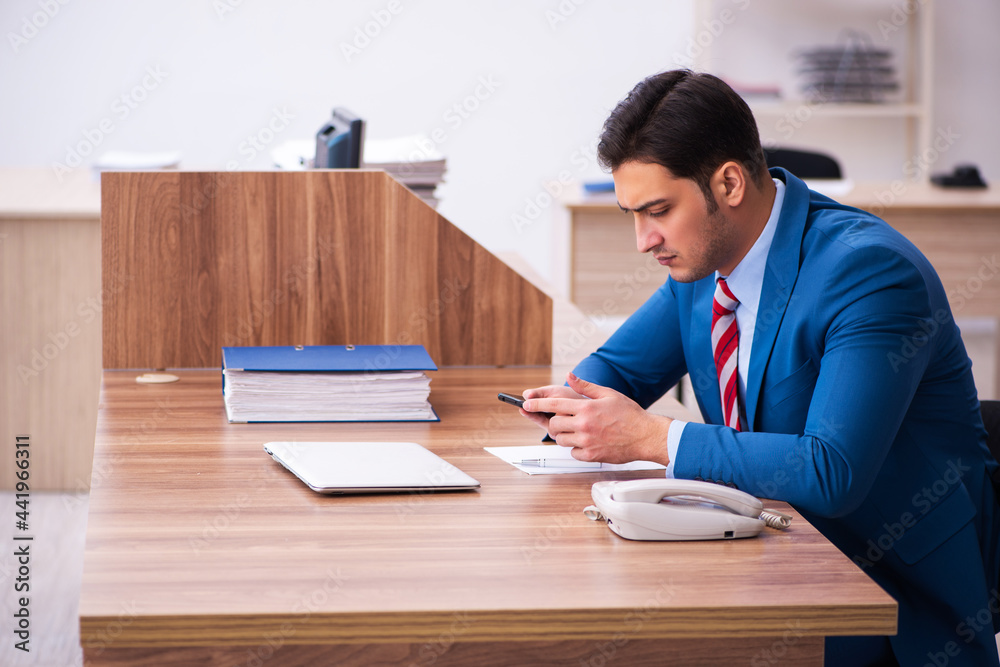 Young businessman employee working in the office Young businessman employee working in the office