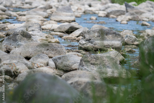 Stream flowing through white rocks,blur effect
