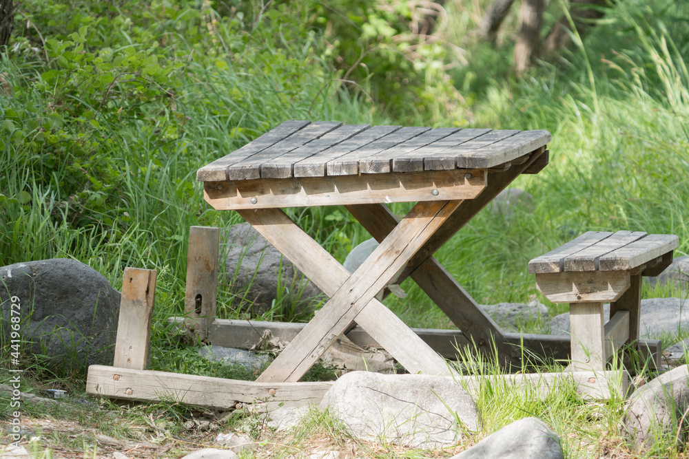 broken wooden picnic table in the forest broken wooden picnic table in the forest