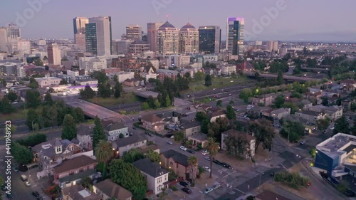 Aerial: Oakland City Skyline and 980 freeway at sunset. Oakland, USA photo