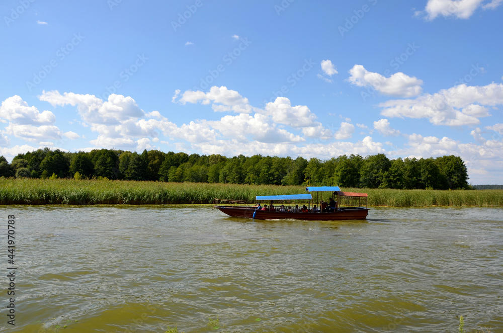 boat with vacationers boat trip along the river