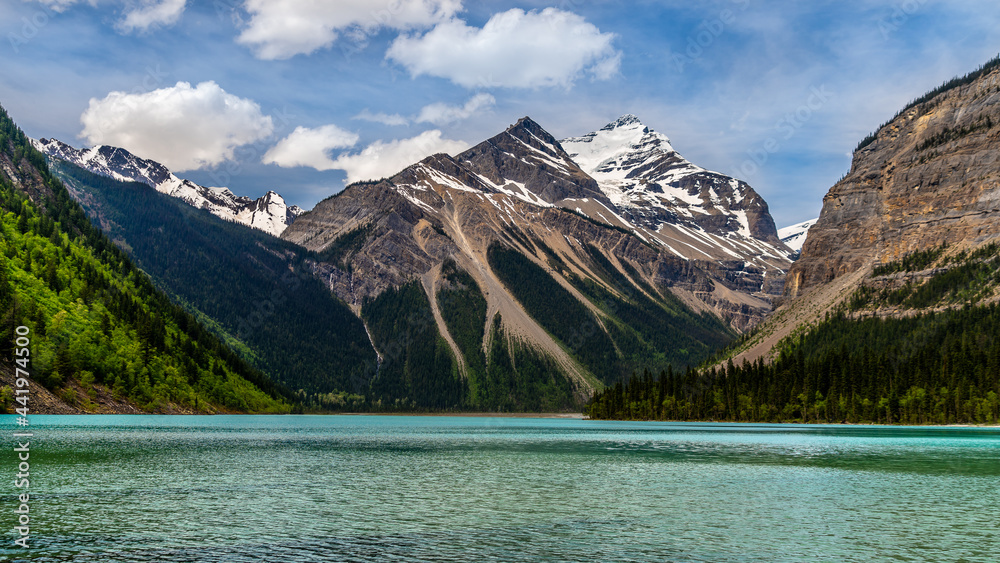 The turquoise water of Kinney Lake in Robson Provincial Park in the Canadian Rockies in British Columbia, Canada. Whitehorn Mountain and Cinnamon Peak in the background