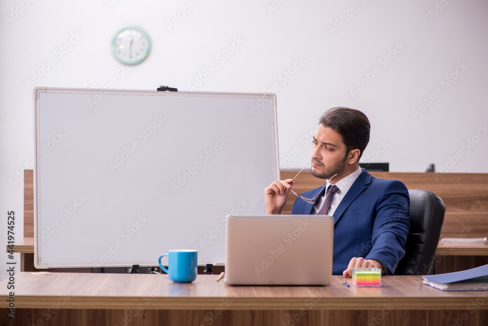 Young handsome employer in teleconference concept Young handsome employer in teleconference concept