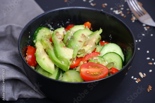 Vegetable salad with avocado, tomatoes, cucumbers. Food. Cooking.