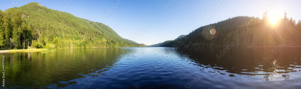 Panoramic View of Buntzen Lake surrounded by Canadian Mountain Landscape. Sunny Summer Evening. Located in Anmore, Vancouver, British Columbia, Canada. Nature Background Panorama