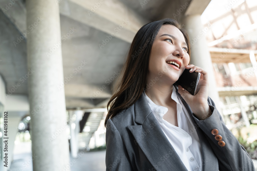 Happy Confident young asian businesswoman use the smartphone. business successful technology Happy Confident young asian businesswoman use the smartphone. business successful technology