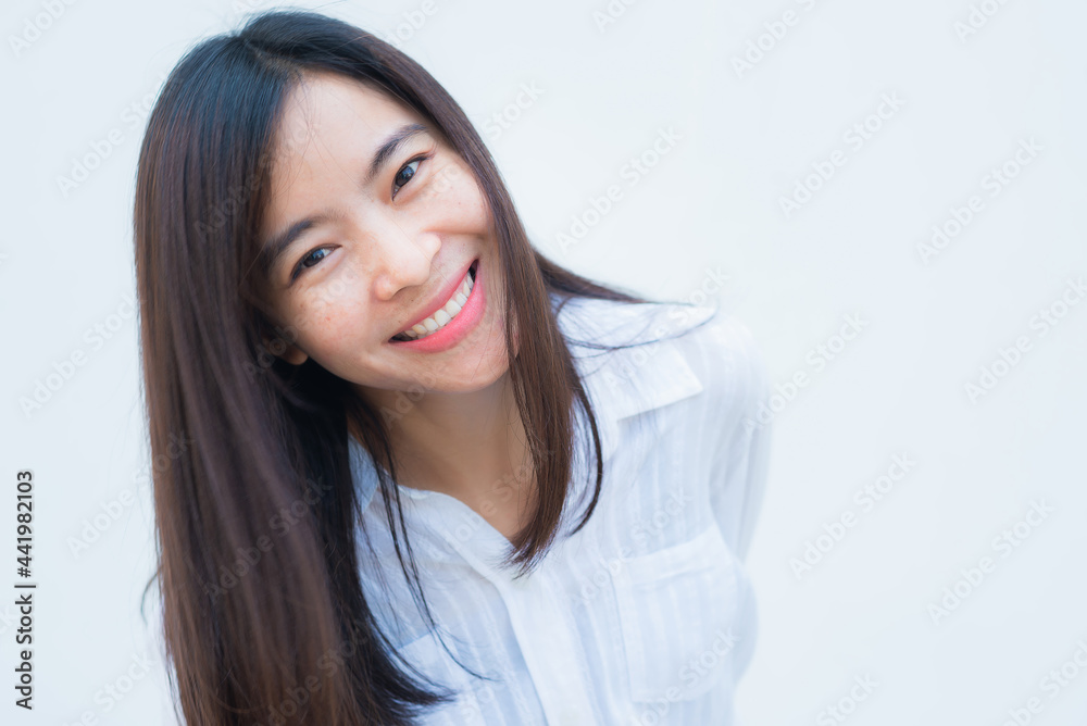 close up attractive adult business woman asian girl with happy and smile against white concrete wall office. close up attractive adult business woman asian girl with happy and smile against white concrete wall office.
