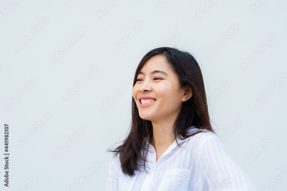 close up attractive adult business woman asian girl with happy and smile against white concrete wall office. close up attractive adult business woman asian girl with happy and smile against white concrete wall office.